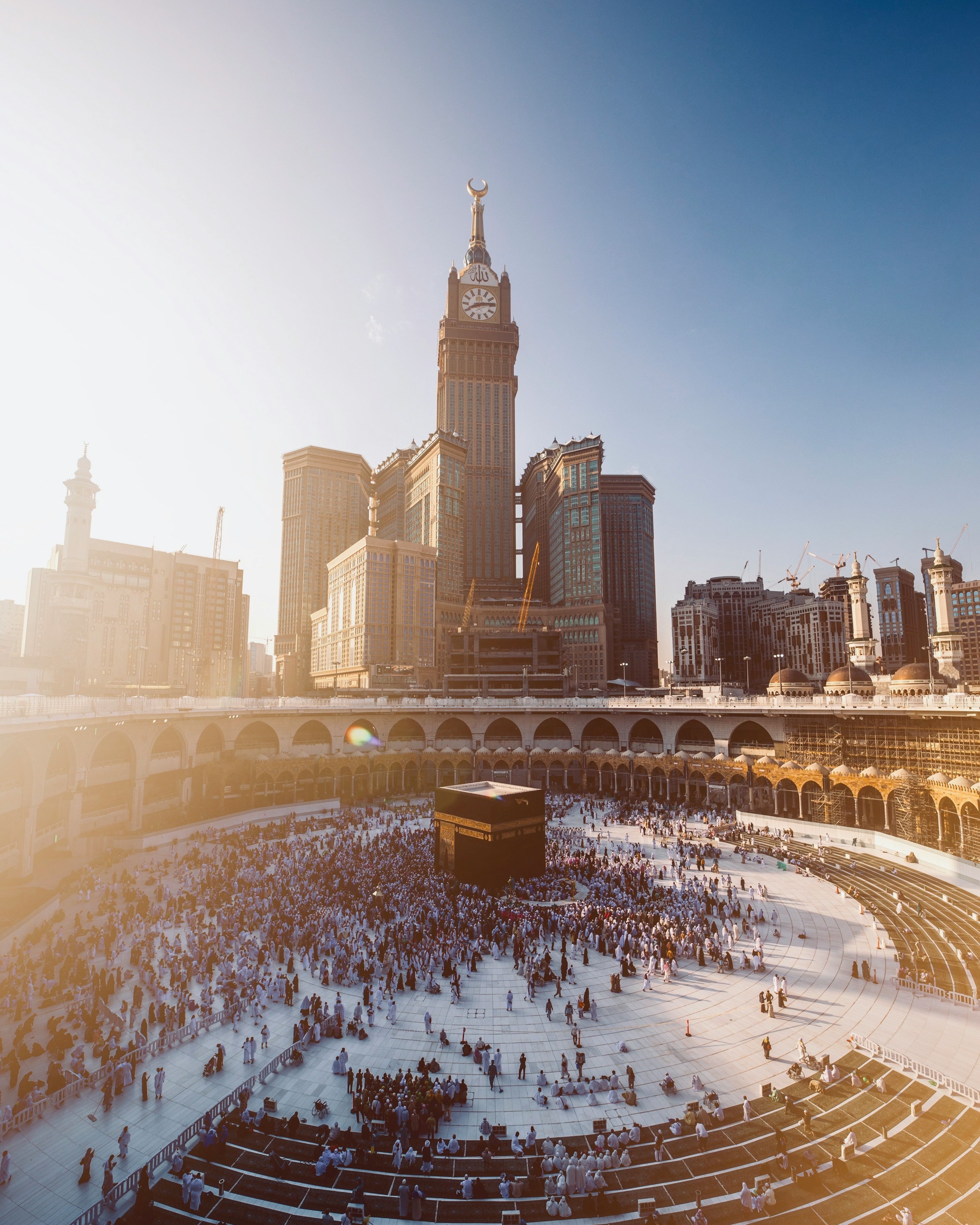 The Holy Kaaba at the Masjid al-Haram in Makkah, surrounded by pilgrims in white ihram